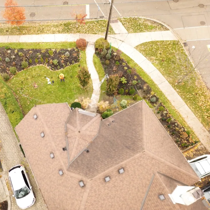 Drone Footage – Residential Christmas Lights Installation Drone view of a technician preparing Christmas lights installation on a residential property in the GTA.