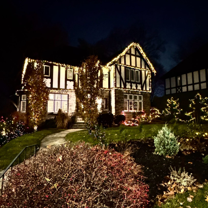 Christmas Lights Installation on Tudor-Style Home at Night Beautifully lit Tudor-style home with professional Christmas lights installed on the roofline and surrounding landscape in the GTA.